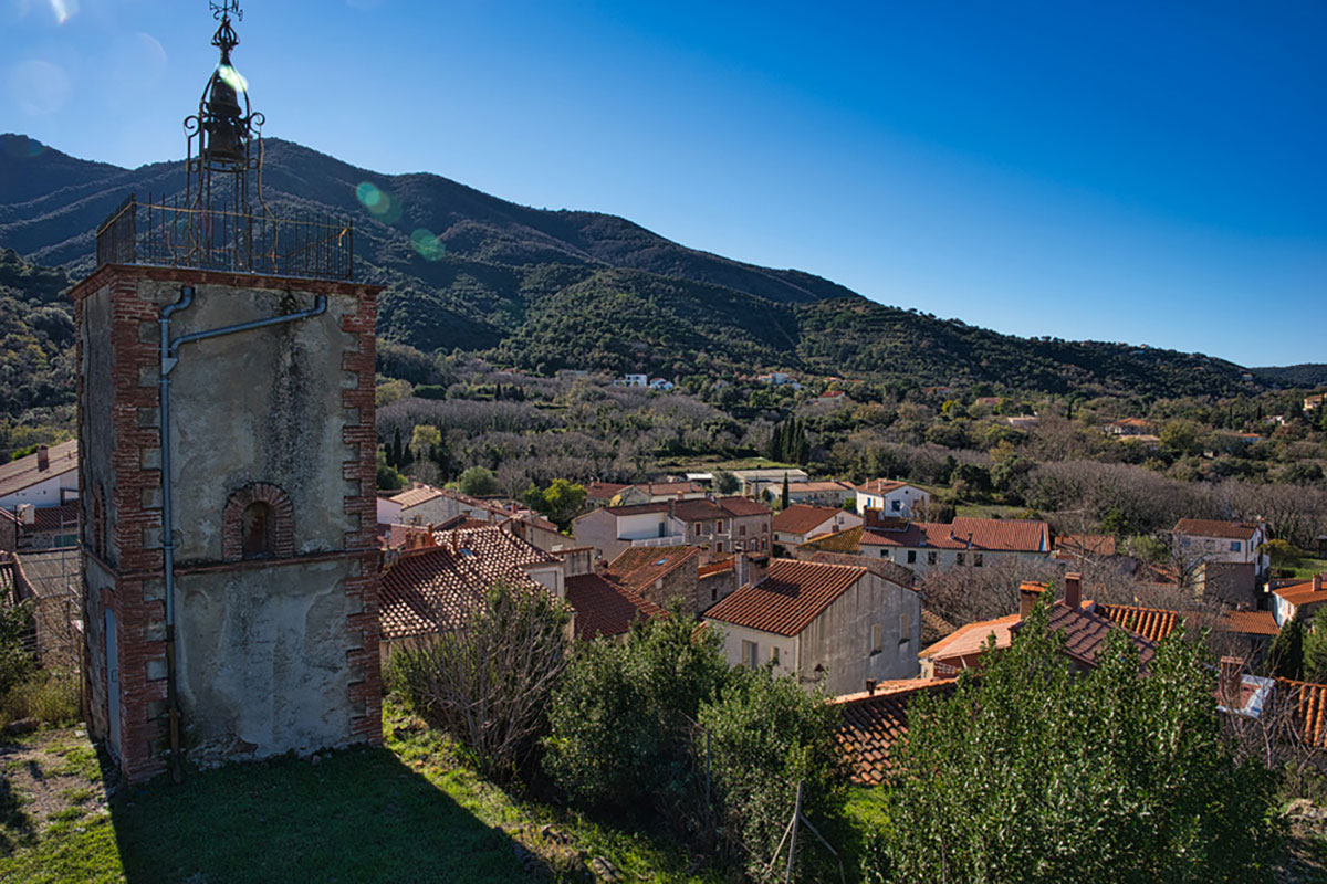 A belltower backlit in Les Alberes